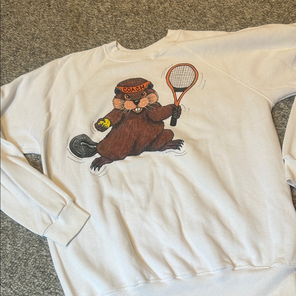 Vintage raglan sweatshirt featuring a tennis playing beaver from Oregon State